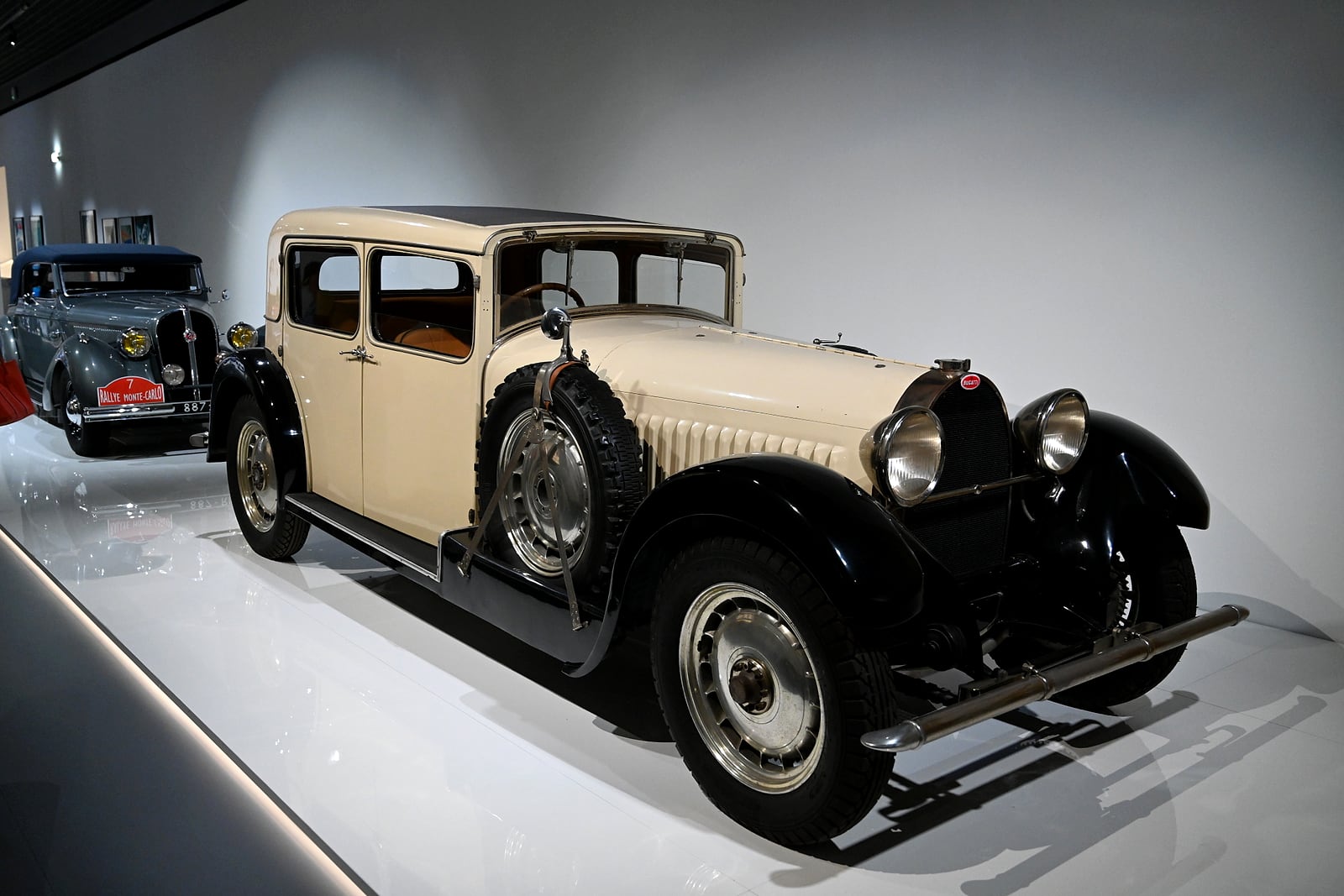 Cream vintage sedan on display